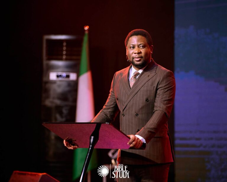 Apostle Femi Lazarus preaching during a Christian gathering